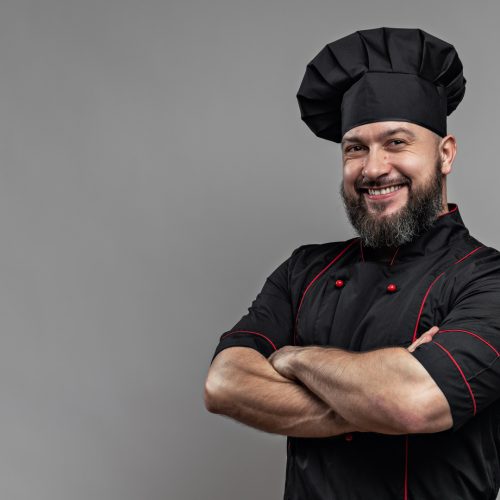 bearded chef with his arms crossed. PLACE FOR TEXT